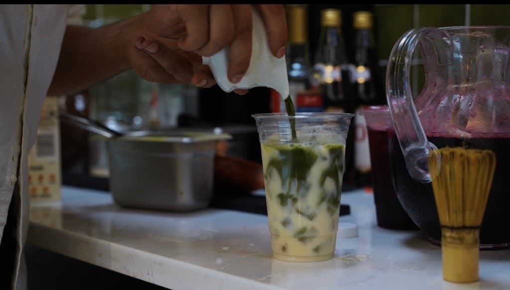 Iced matcha poured into milk