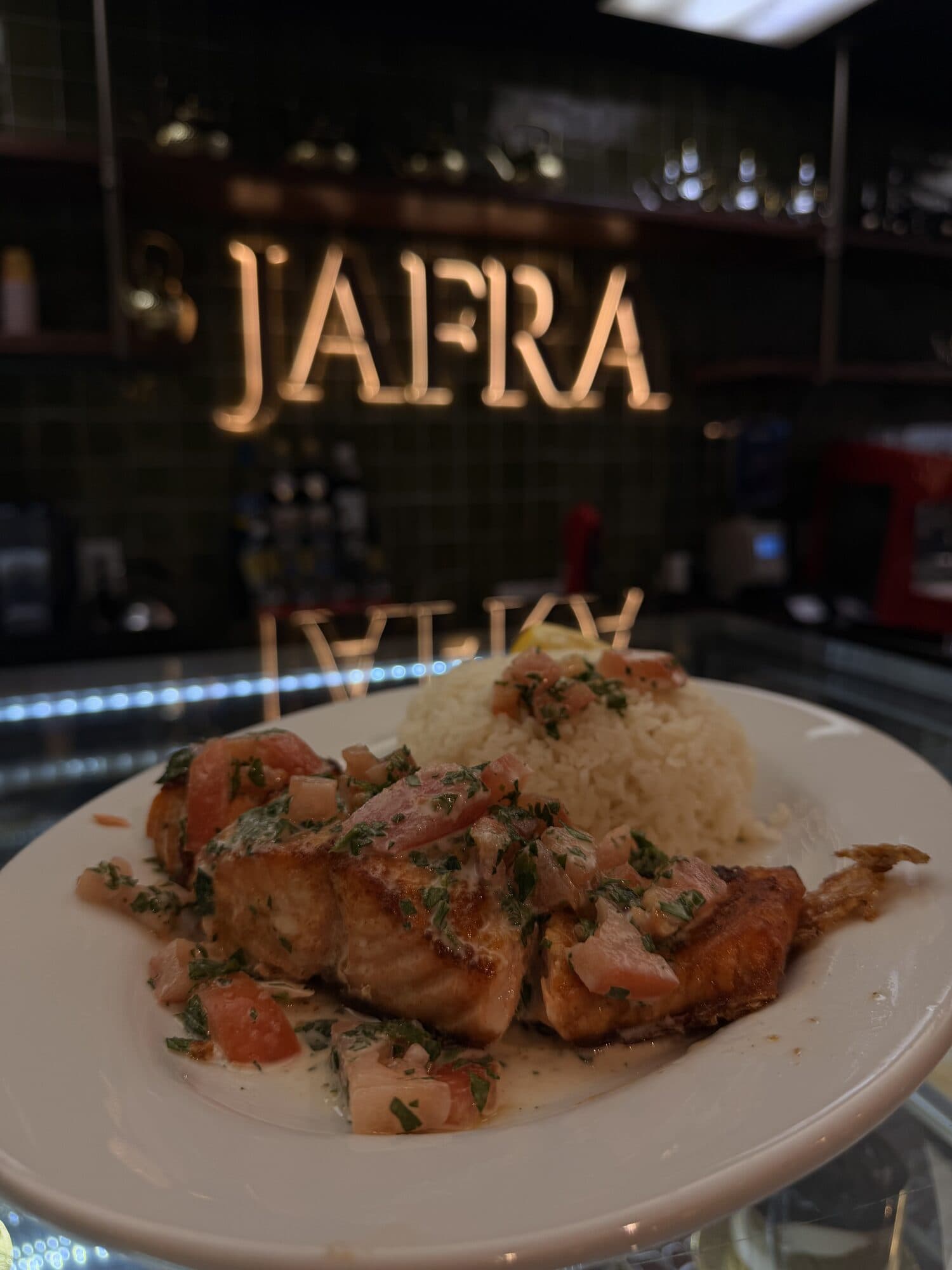 Seared salmon with herbed tomato and rice
